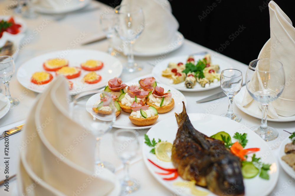 table set service with silverware and glass stemware at restaurant before party table set service with silverware and glass stemware at restaurant before party