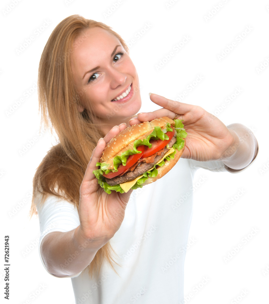 Fast food concept. Woman show tasty unhealthy burger sandwich