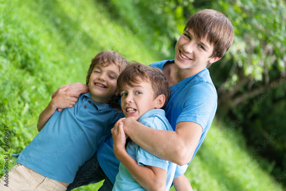 Portrait of three happy brothers Portrait of three happy brothers