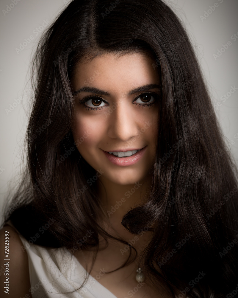 Portrait of a Beautiful Smiling Young Brunette Woman Portrait of a Beautiful Smiling Young Brunette Woman