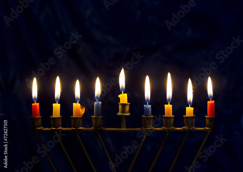 Hanukkah menorah on a dark blue background