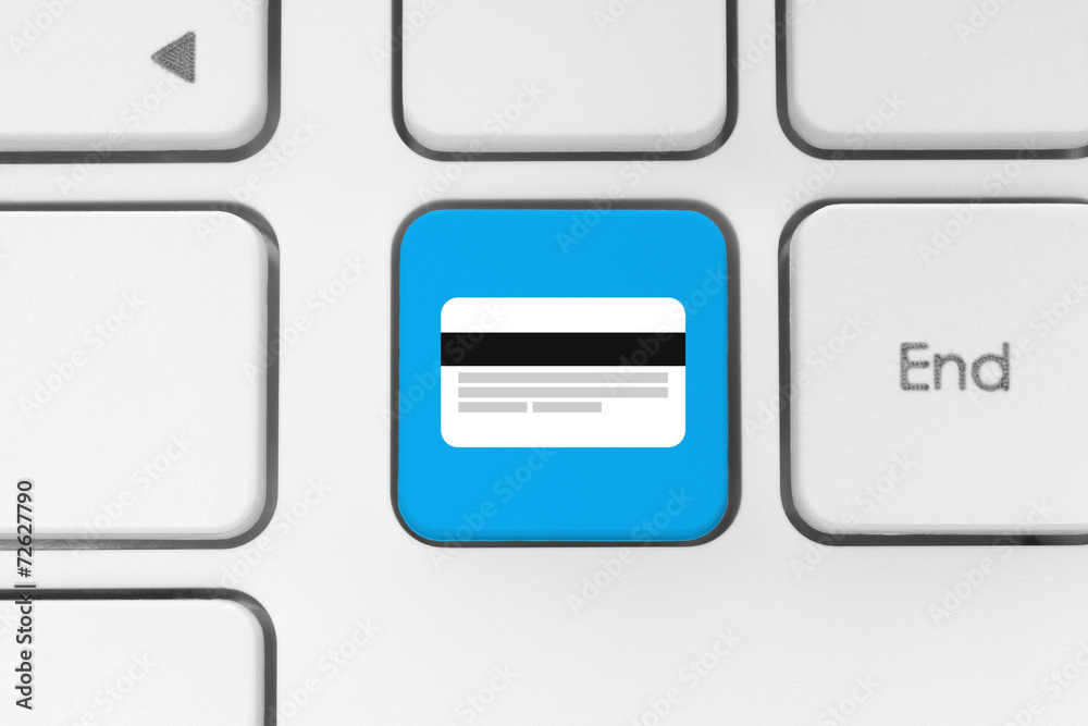 Blue button with credit card on the keyboard close-up. Blue button with credit card on the keyboard close-up.