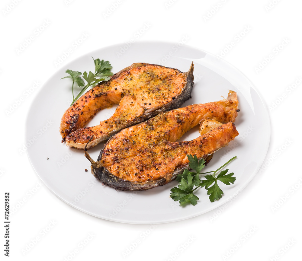 Baked trout slices isolated on white background