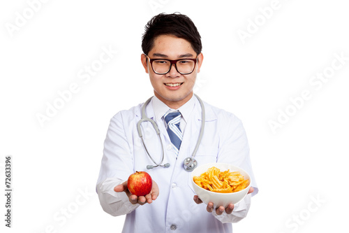 Asian male doctor smile with red apple and potato chips