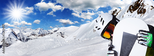 Snowboarder in high mountains