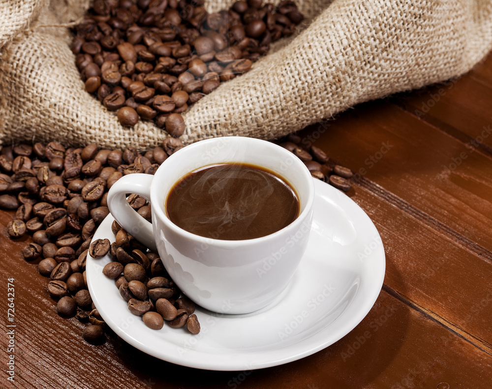 Coffee cup and jute sack full of coffee beans 3