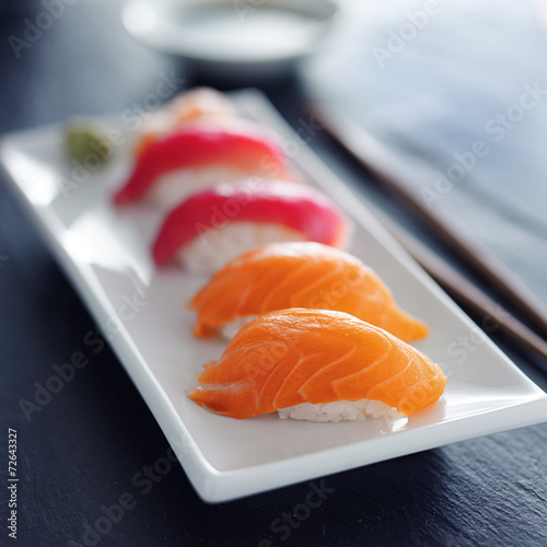 japanese salmon and tuna nigiri on white plate