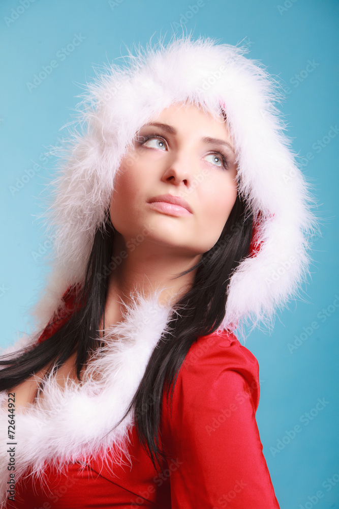 Portrait woman wearing santa claus costume on blue Portrait woman wearing santa claus costume on blue
