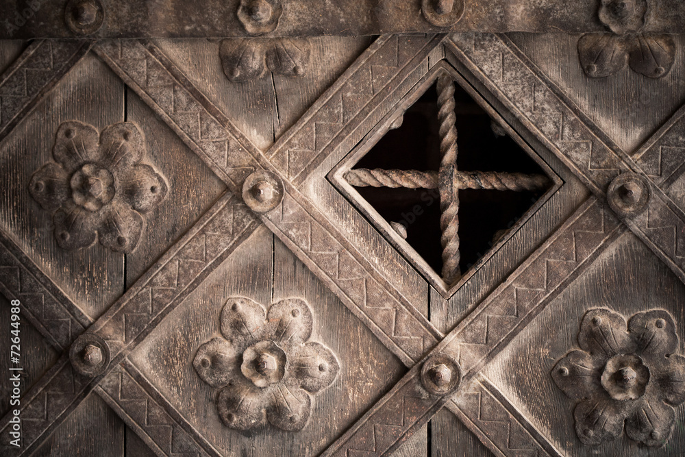 Architectural detail. Part decorative old wooden door Architectural detail. Part decorative old wooden door