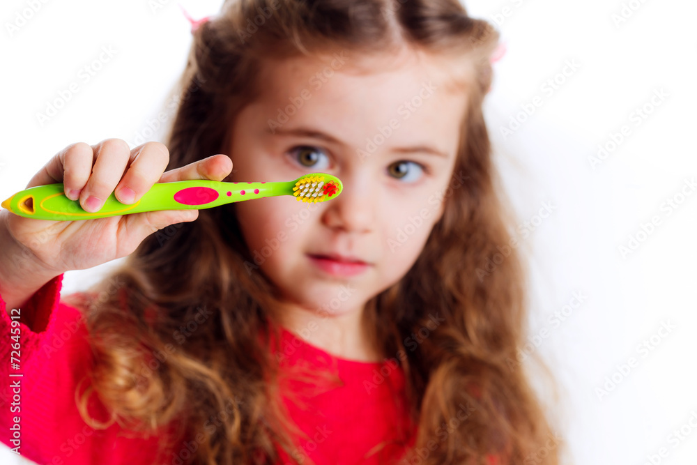 Little girl brushing her teeth isolated on white background Little girl brushing her teeth isolated on white background