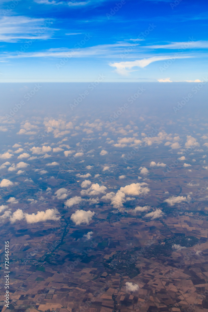 Aerial view of clouds and village