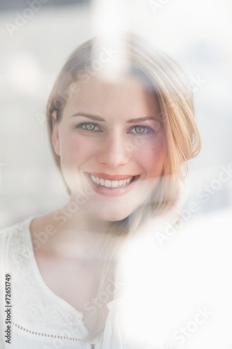 Portrait of a smiling blonde woman looking at camera