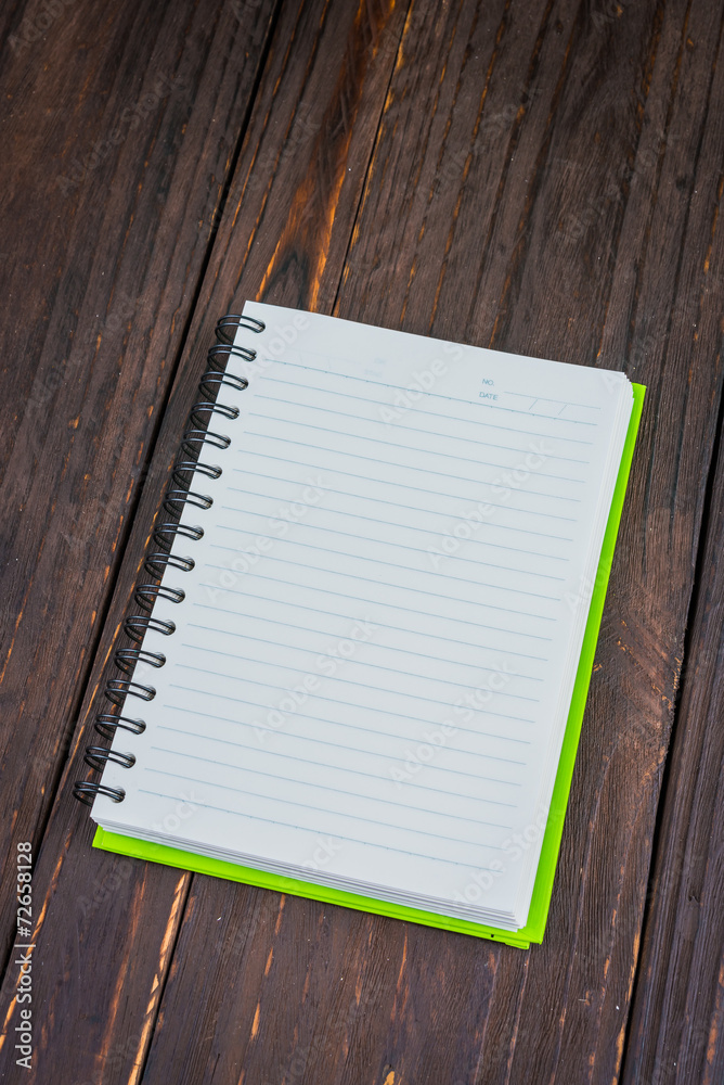 Note book on wooden background Note book on wooden background