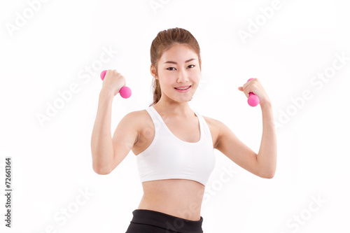 portrait of pretty sporty girl, hand holding dumbbell