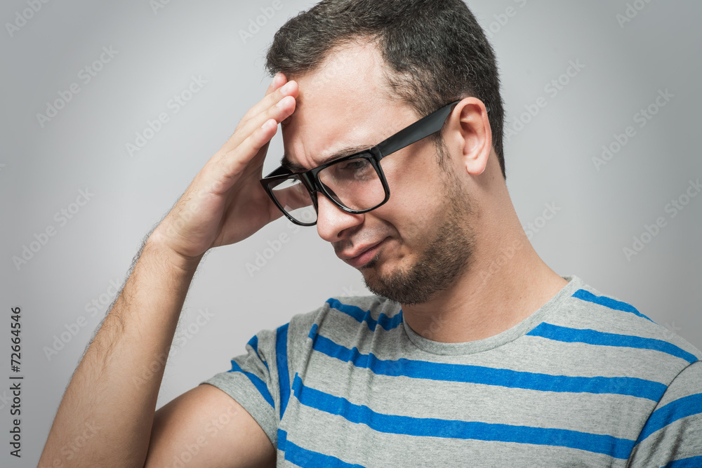 Obraz premium standing young tired man yawning and stretching