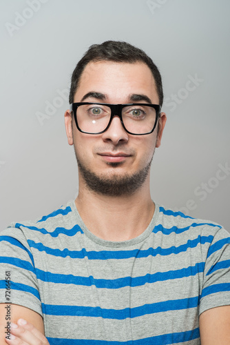 Young cool trendy man with glasses smiling © slasnyi