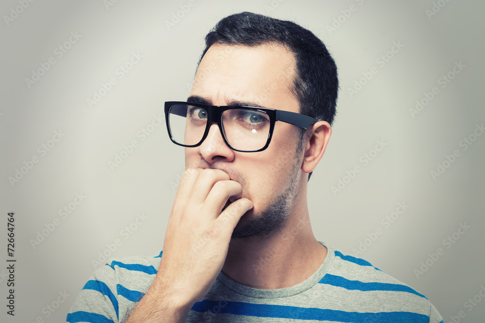 Resentful young man in glasses Resentful young man in glasses