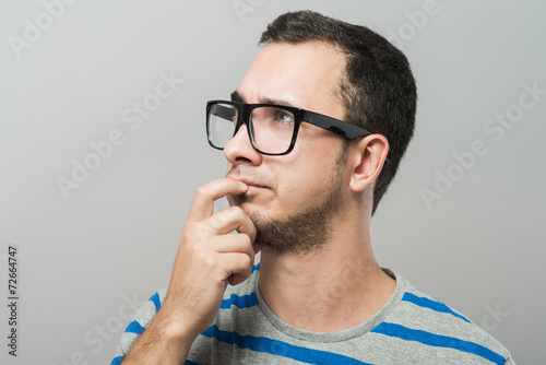 profile of a young business man thinking