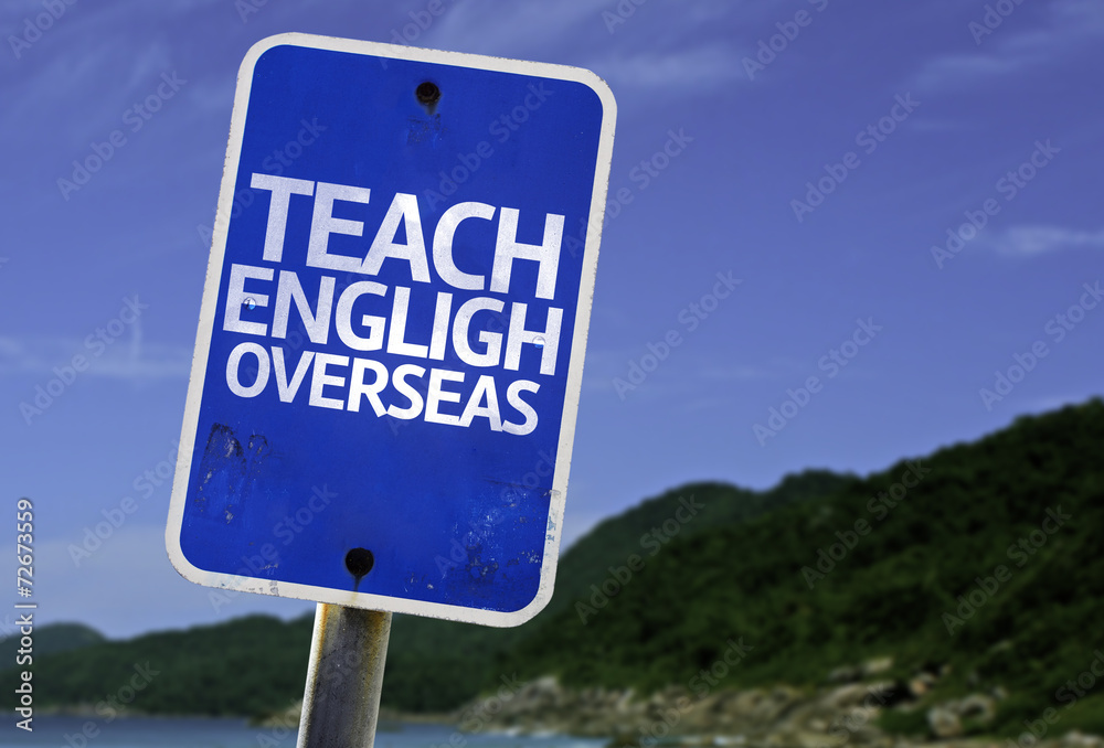 Teach English Overseas sign with a beach on background