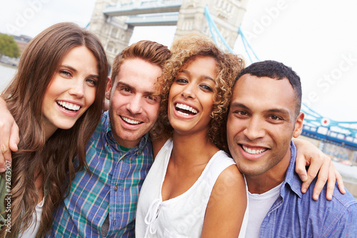 Photography Portrait Of Friends Visiting Tower Bridge In London