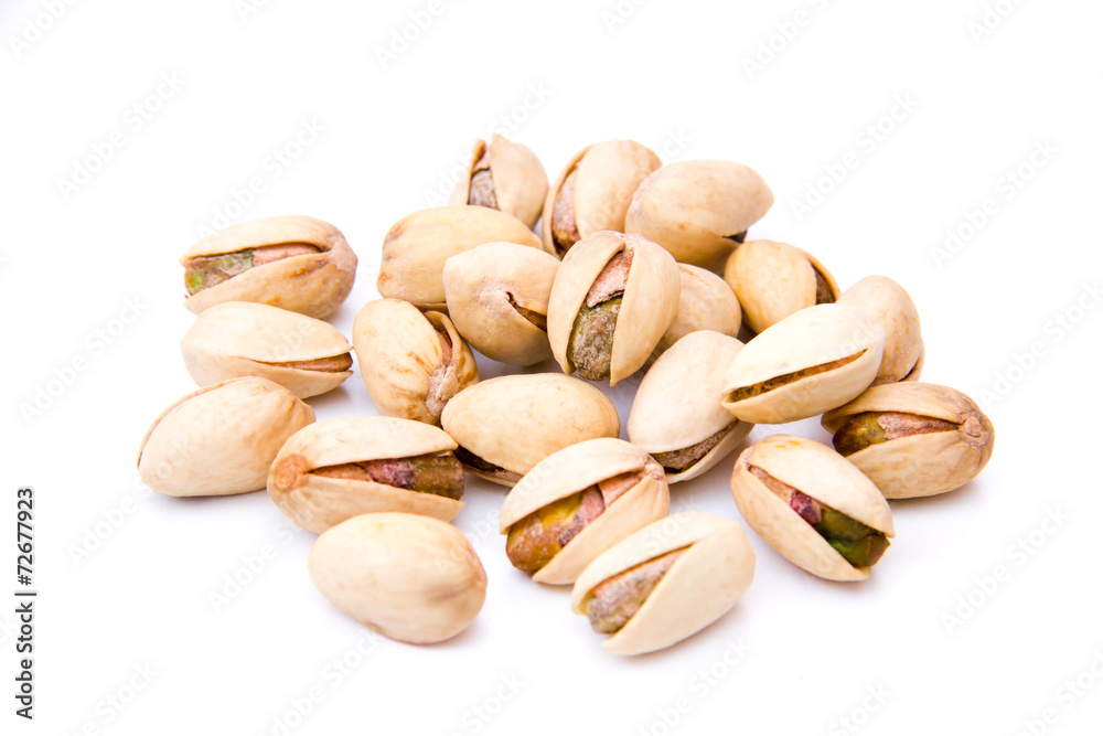Pistachios on white background viewed from front