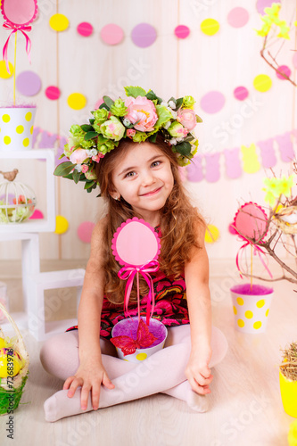 Easter concept. Beautiful girl in the room with decorations