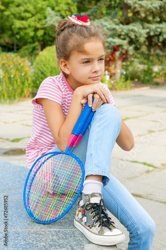 Cute girl with racket Outdoors