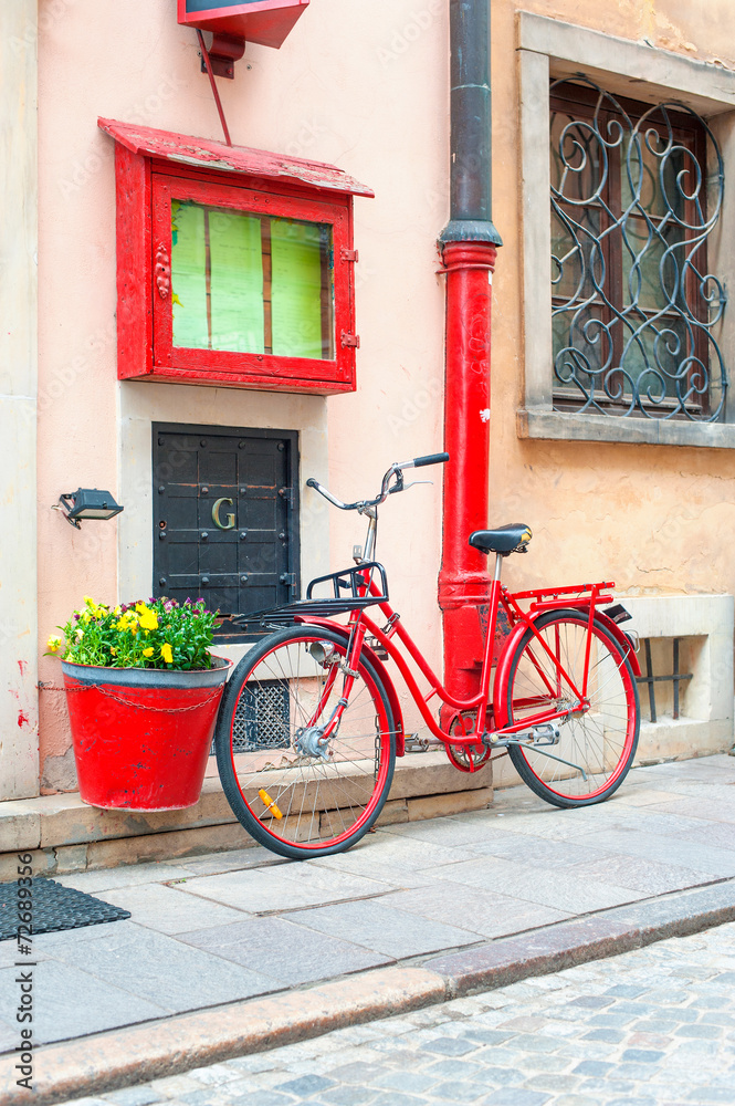 Red retro bicycle. Outdoors.