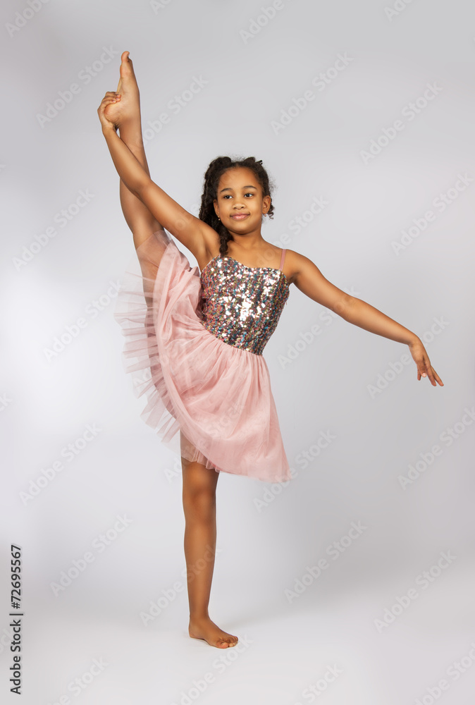 Image of flexible little girl doing vertical split Image of flexible little girl doing vertical split
