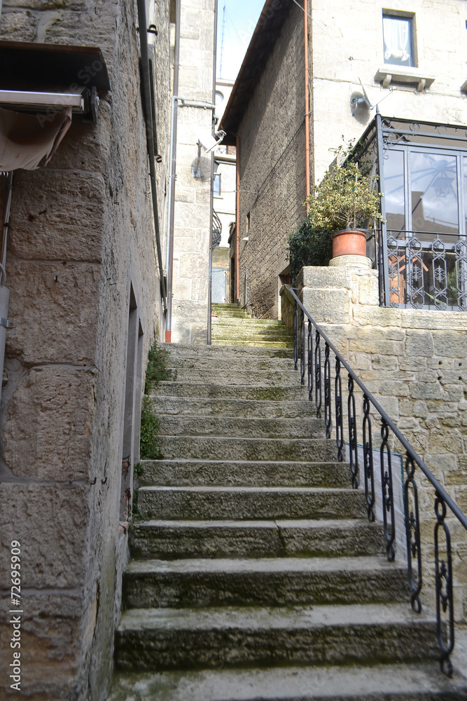 Old stairs on medieval narrow street
