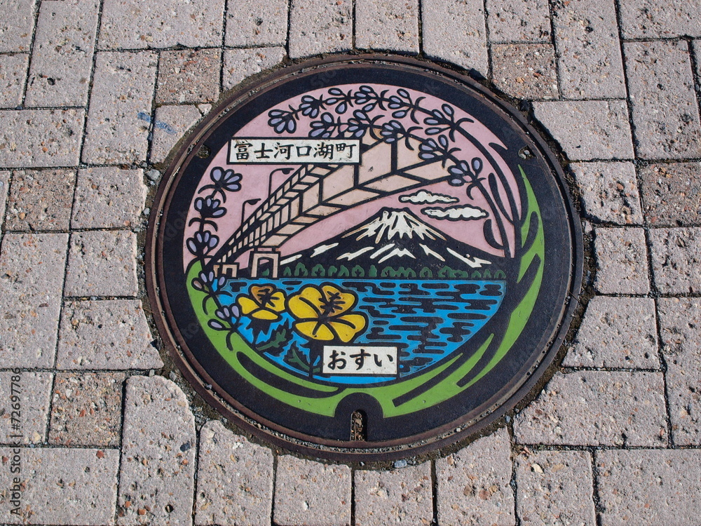Manhole drain cover on the street at Kawaguchiko lake, Japan
