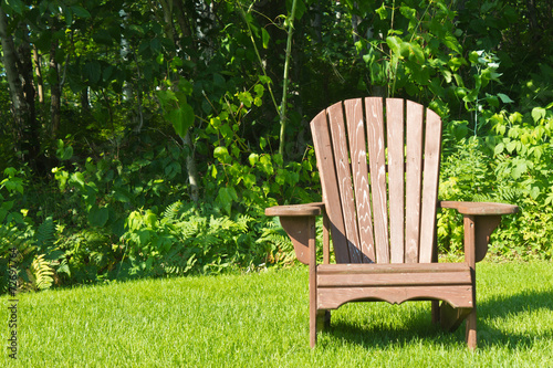 Adirondack summer lawn chair outside on the green grass