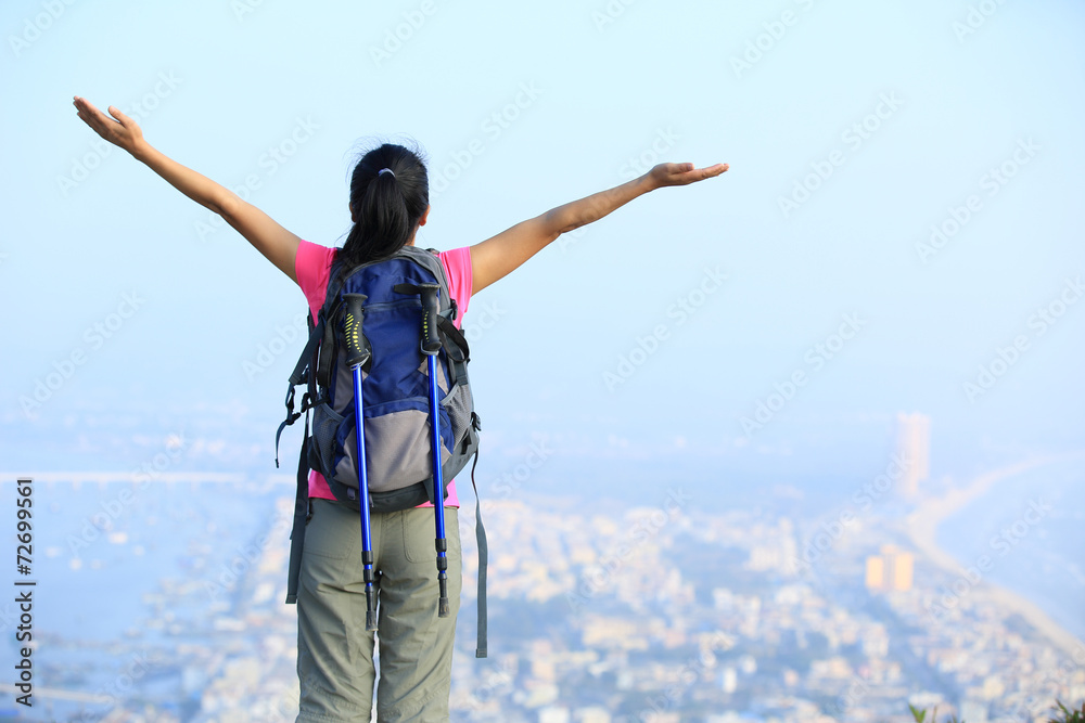 cheering woman hiker seaside mountain peak cheering woman hiker seaside mountain peak