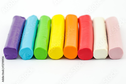 Colorful rod plasticine arranging on white background