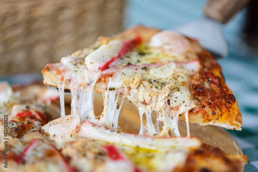 Seafood cheese pizza serving on the table