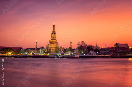 Wat arun main pagoda in sunset Bangkok Thailand