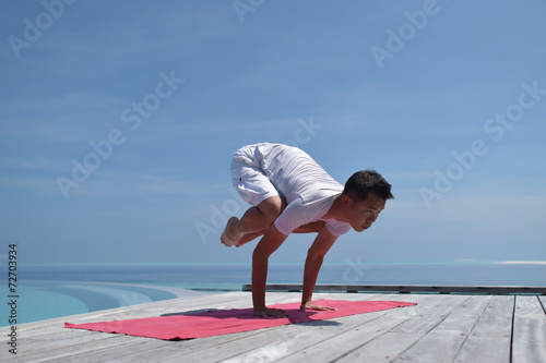 Photography Asian chinese woman in yoga pose by the sea
