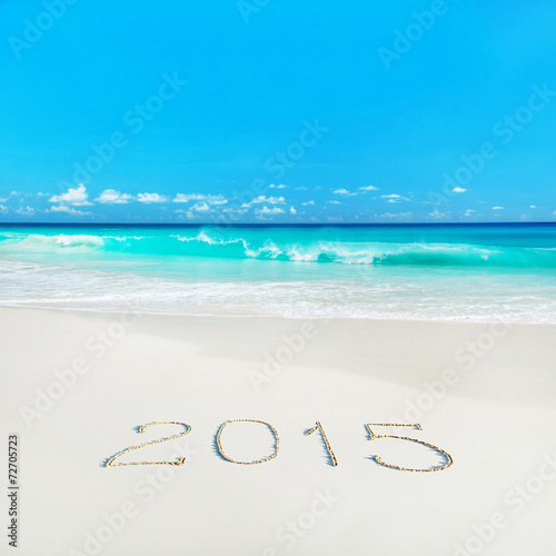 Happy New Year 2015 season concept on tropical sandy beach