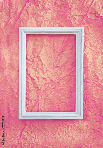 Frame on pink wrinkled paper