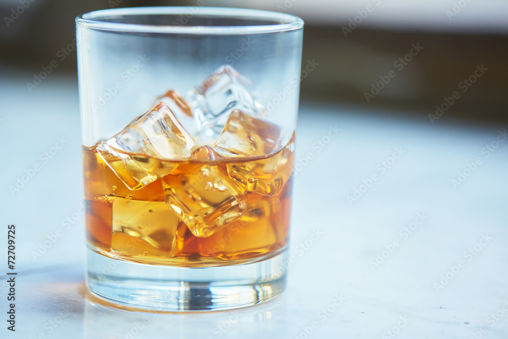 whiskey with ice on a table