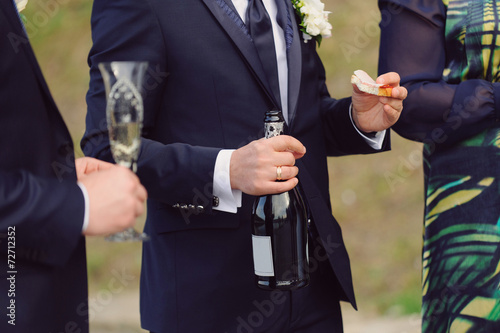 Groom with Bottle and Sandwich