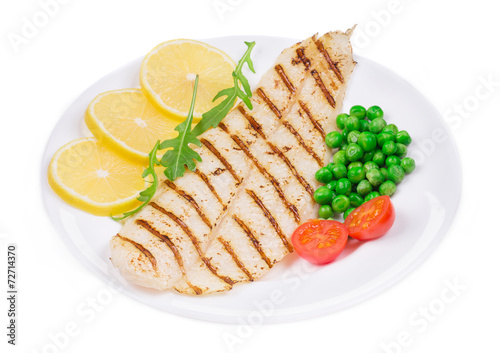 Grilled fish fillet with vegetables.