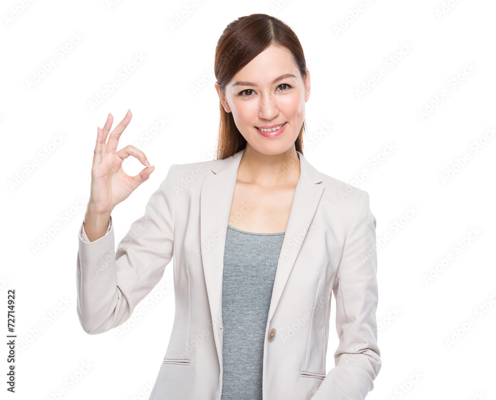 Asian businesswoman with ok sign Asian businesswoman with ok sign