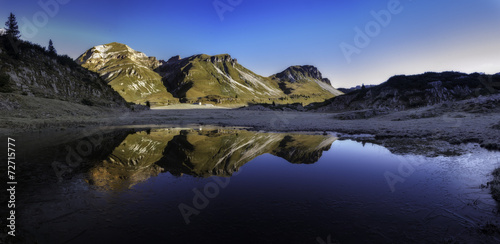 Mountains reflected in a small lake