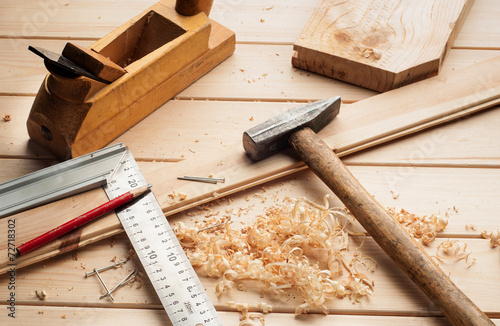 carpenter tools, plane, hammer,meter, nails,shavings, and chisel