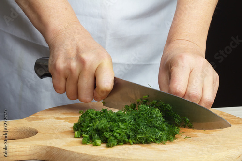 Chopping green dill