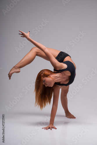 Woman gymnast stretching photo