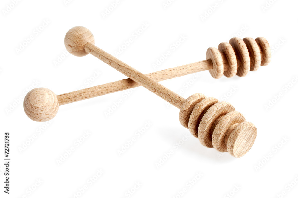 Wooden spoons for honey on a white background Wooden spoons for honey on a white background