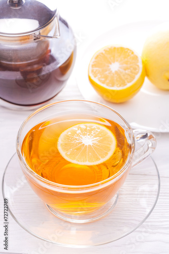 Cup of tea with lemon on table