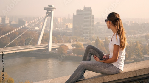 girl sitting over Bratislava